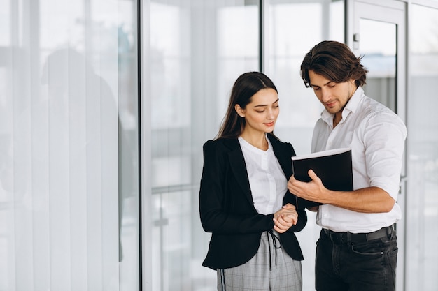 Two collegues working in a business center