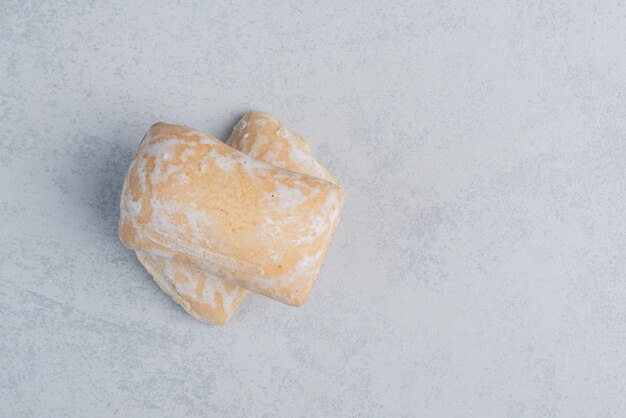 Two cookie wrappings on marble surface