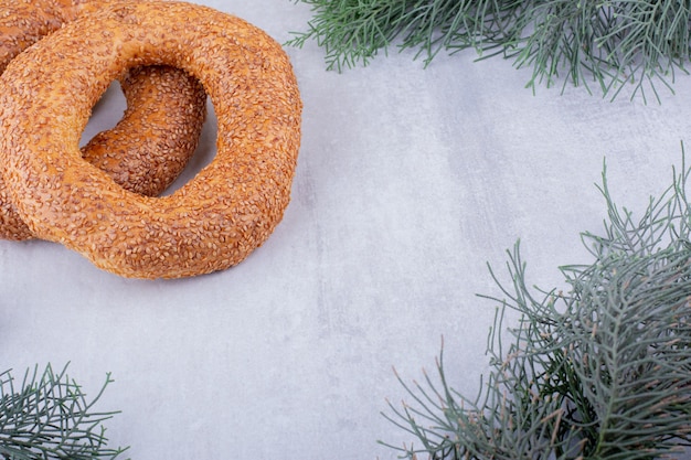 Two crisp bagels on white background.