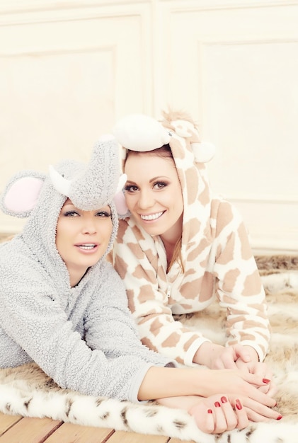 Two cute girls in pajamas having fun.