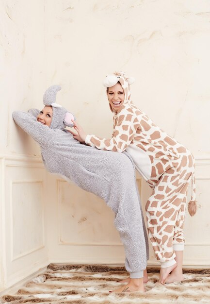 Two cute girls in pajamas having fun.