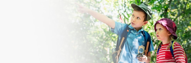 Two cute kids trekking in the forest design space banner