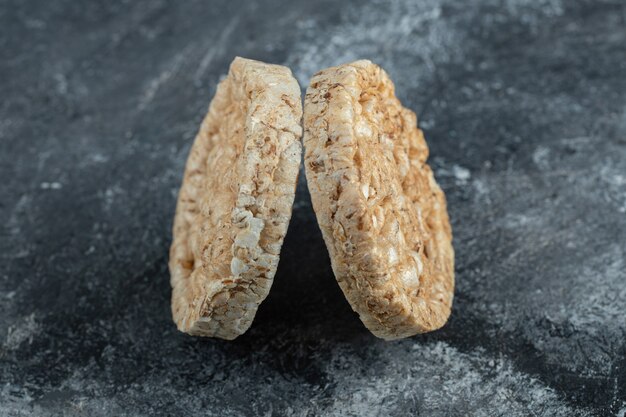 Two delicious crispbread on marble surface