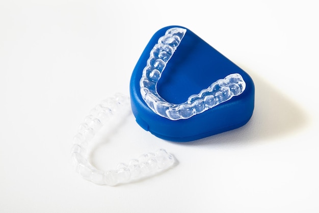 Free photo two dental whitening trays and a box for it