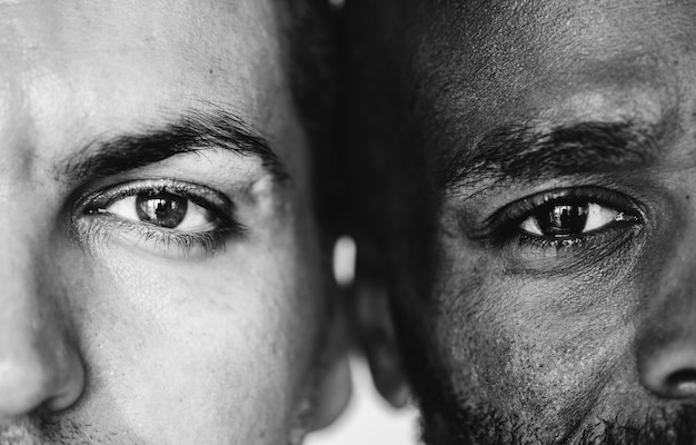 Two different ethnic men's eyes closeup