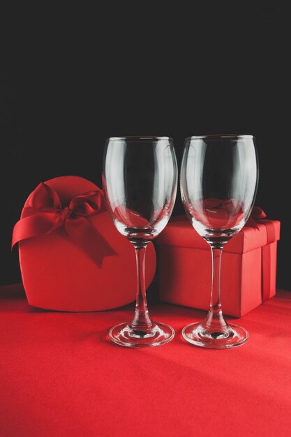 Two empty cups and two gifts behind