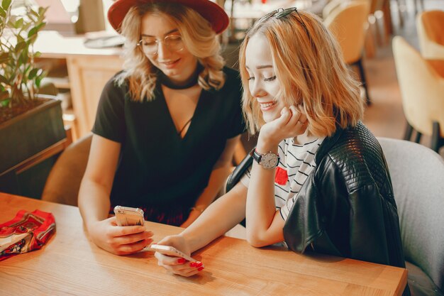 two fashion girls in a cafe