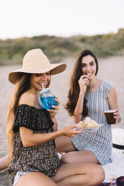 Two female friends at a beach party