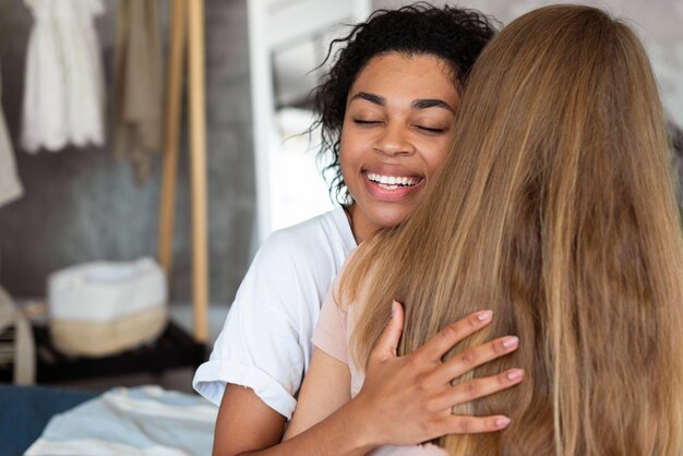 Two female friends hugging each other