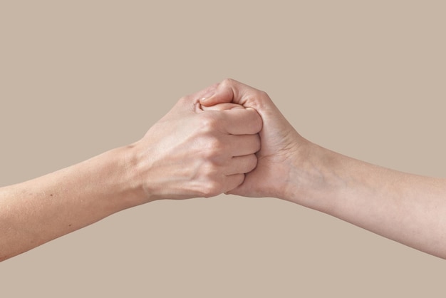 Free photo two female handshake or arm wrestling