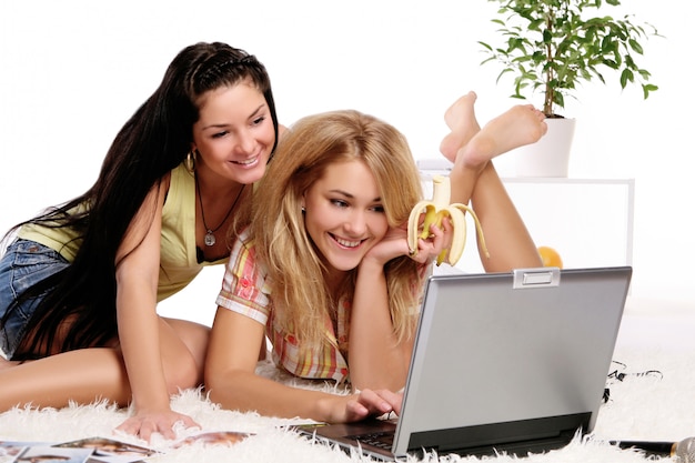 Two female model working on computer