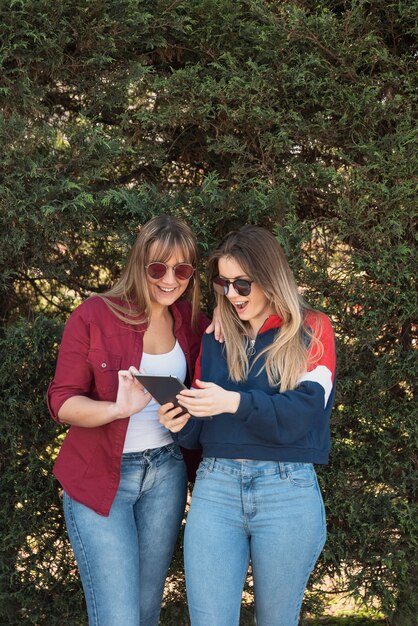 Two females looking on tablet mock-up