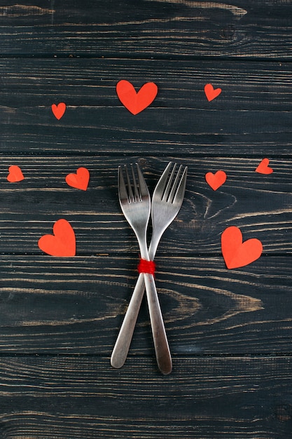 Two forks with paper hearts