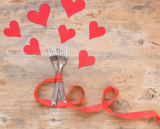 Two forks with paper hearts