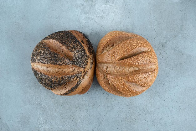 Two fragrant bread on marble.