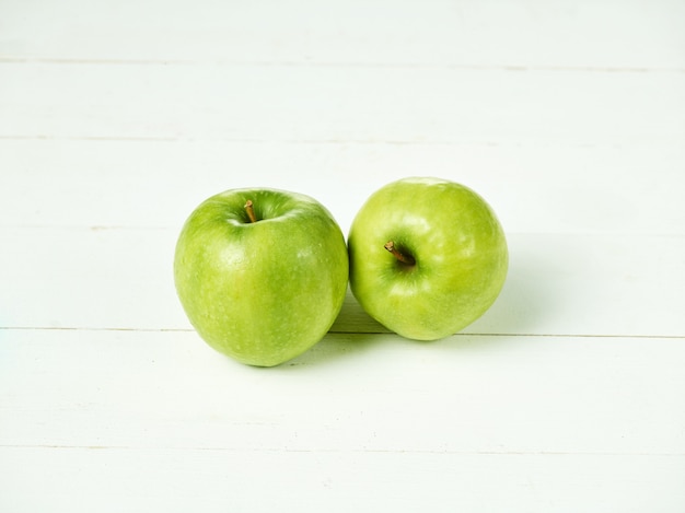 Two fresh green apples