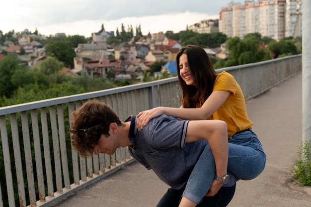 Free photo two friends fooling around outdoors