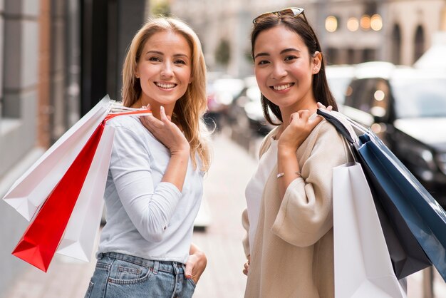 Two friends posing while out for a shopping spree