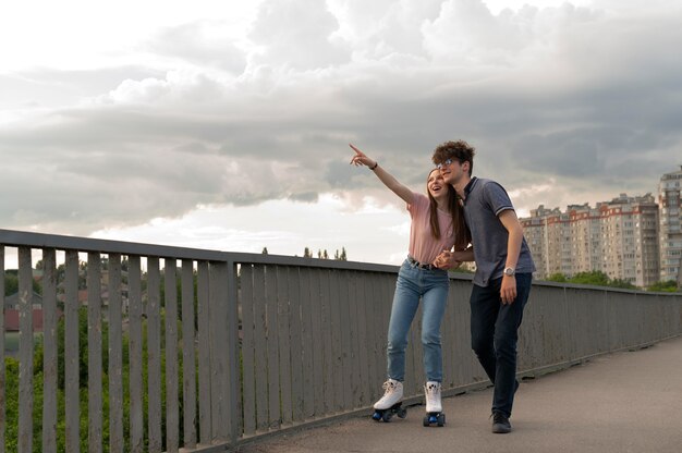 Two friends spending time together outdoors using roller skates