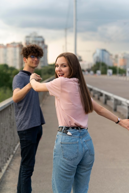 Two friends spending time together outdoors using roller skates