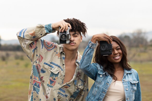 Two friends taking photo while going out in the city