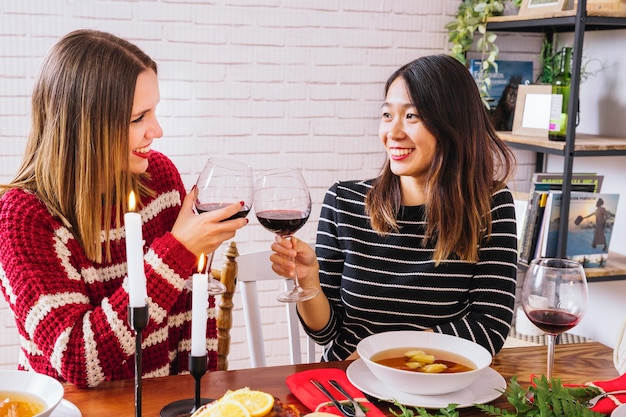 Two girlfriends at christmas dinner