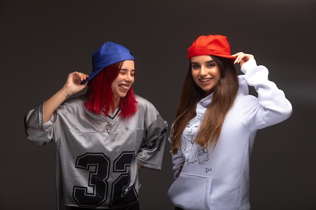 Two girlfriends in sport outfits having fun.