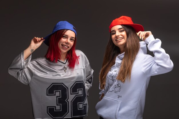 Two girlfriends in sport outfits having fun.