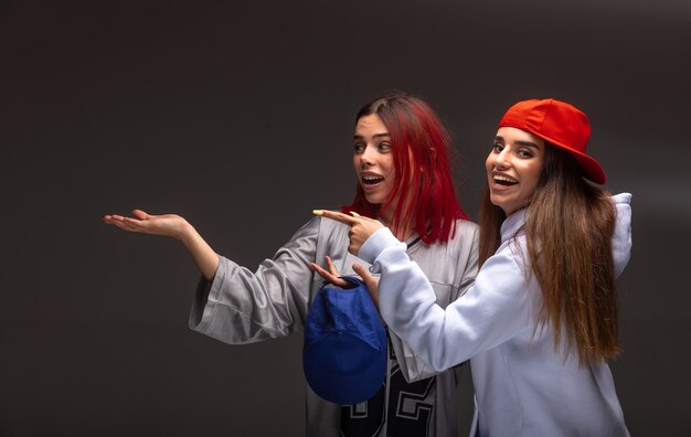 Two girlfriends in sport outfits having fun.