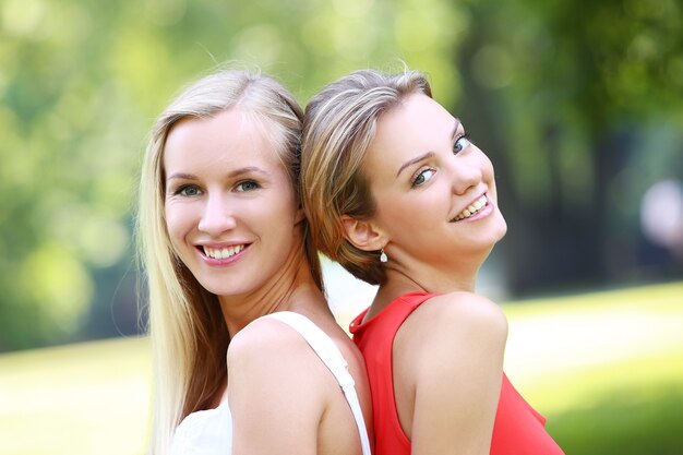 Two girls are having fun in the park