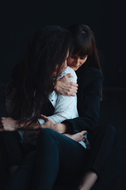 Two girls in each other's tender embraces