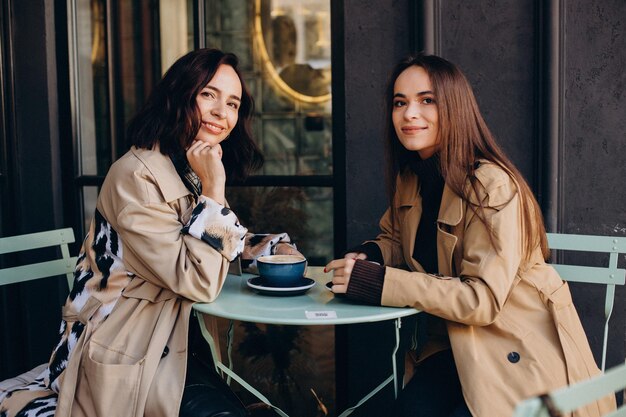 Two girls friends at the cafe together