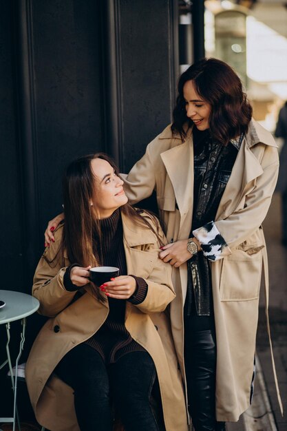 Two girls friends at the cafe together