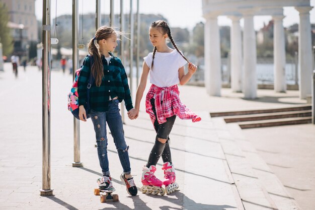 Two girls friends roller skating