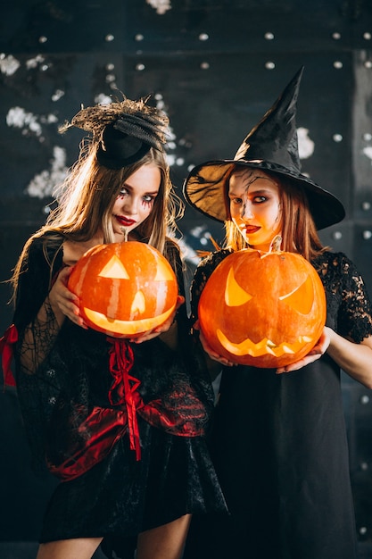 Two girls in halloween costumes