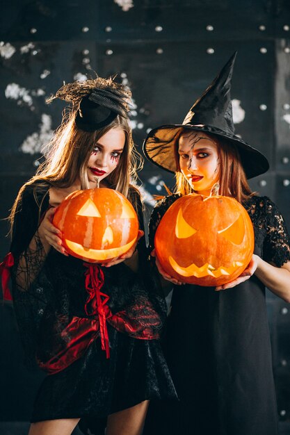 Two girls in halloween costumes