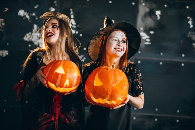 Two girls in halloween costumes