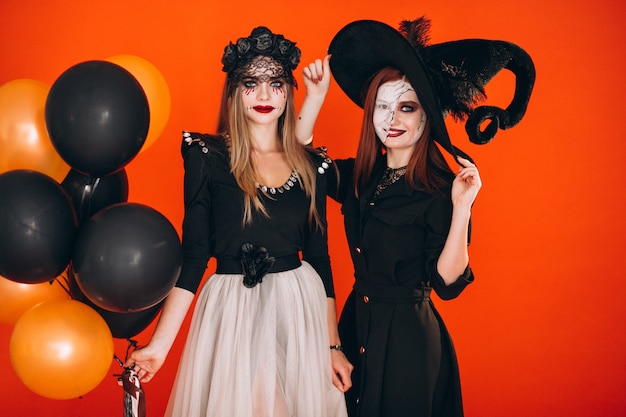 Two girls in halloween costumes