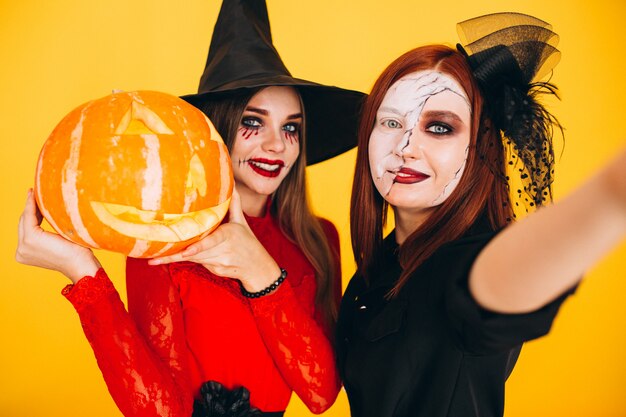 Two girls in halloween costumes