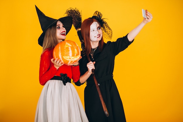 Two girls in halloween costumes