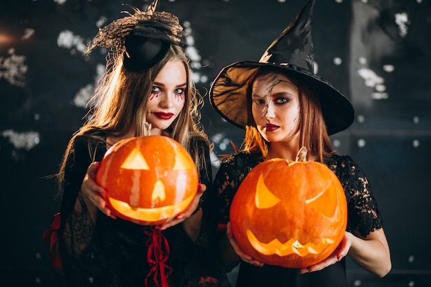Two girls in halloween costumes
