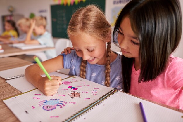 Two girls looking at the picture