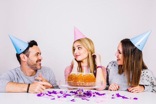 Two girls and a man celebrating birthday