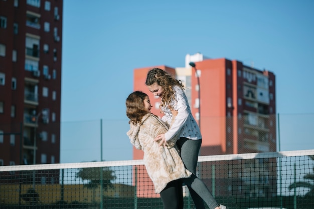 Two girls playing on rooftop