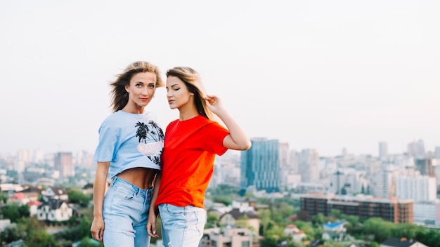 Two girls posing on rooftop