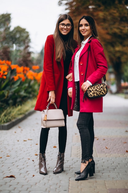 Two girls in red coats models