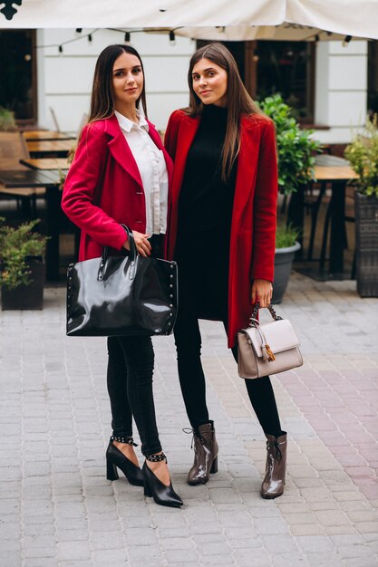 Two girls in red coats models