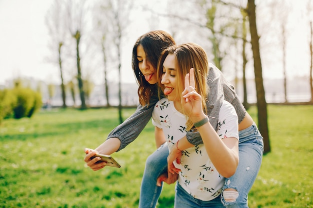 Free photo two girls in a summer park