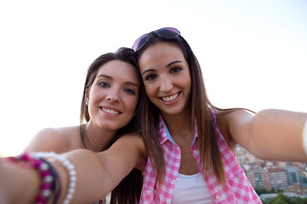 Two girls taking selfie