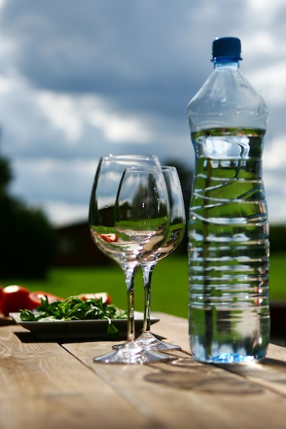 Two glasses of water on table